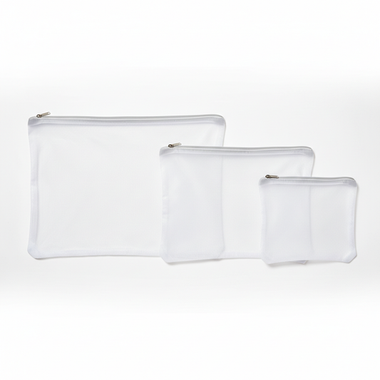 Set of three mesh laundry bags in small, medium and large sizes on white background