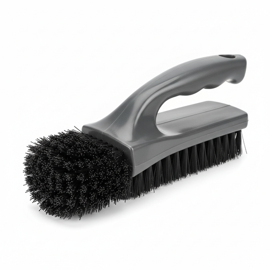 Stiff bristle shoe scrub brush with dark gray plastic handle on white background